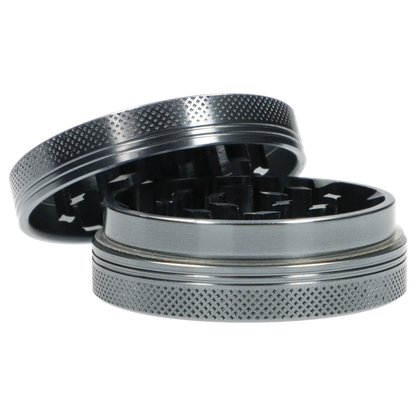 Close-up angled view of the Famous X Chrome 2 pc Grinder - Gray-55mm showing its textured outer rim and exposed interlocking teeth.