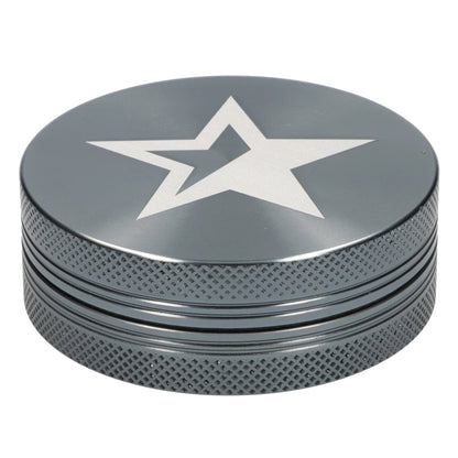 A close-up, angled view of the gray 55mm Famous X Chrome 2 pc Grinder, showcasing its textured metallic surface.