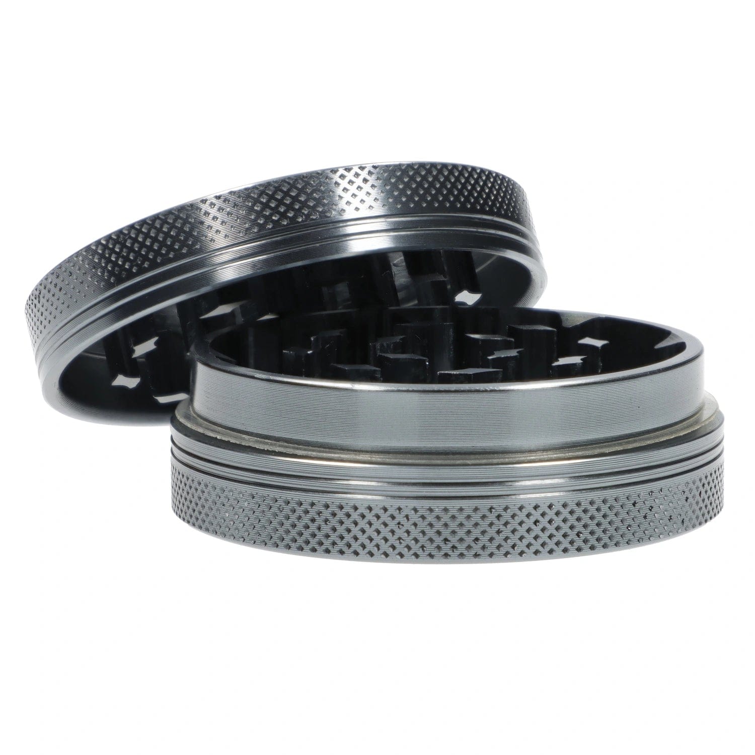 A top-down view of the open Famous X Chrome 2 pc Grinder, revealing its two gray, textured grinding pieces.