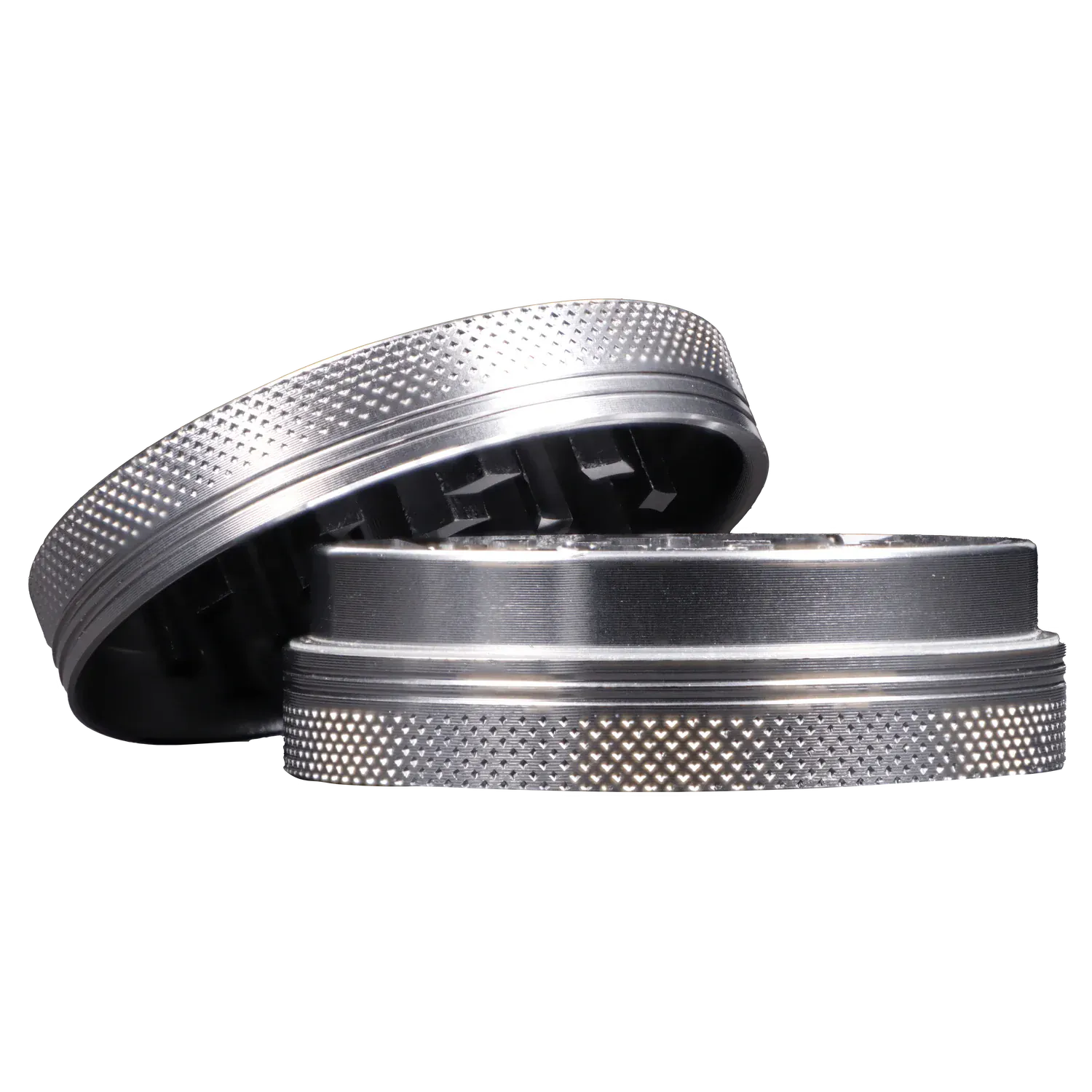 Close-up side view of the Famous X - Crystal 2 pc Grinder-Silver-55mm showing its textured silver top and inner teeth.