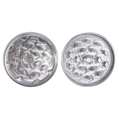 Top-down view of the two halves of the Famous X - Crystal 2 pc Grinder-Silver-55mm showing silvery interlocking teeth and a central magnet.