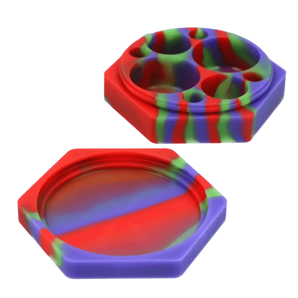 Top-down view of the Valiant Silicone Hexagon 8 compartment Container - 110 ml showing its two-piece red, purple and green marbled hexagonal silicone halves, one with eight rounded wells.