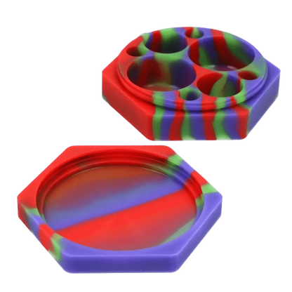 Top-down view of the Valiant Silicone Hexagon 8 compartment Container - 110 ml showing its two-piece red, purple and green marbled hexagonal silicone halves, one with eight rounded wells.