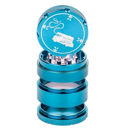 A close-up, angled view of the C&C Up In Smoke Grinder-Aqua, showing its four-piece, metallic blue construction.