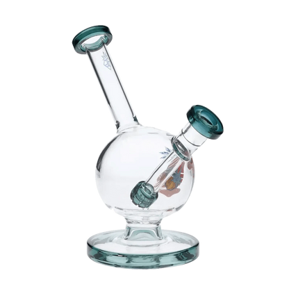 A teal, 7-inch Cabana Cannabis Co. Surf Water Pipe is pictured from a low angle against a plain white backdrop.