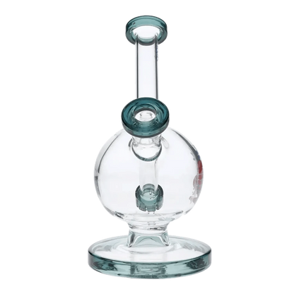 A three-quarter view of the 7-inch Cabana Cannabis Co. Surf Water Pipe in teal glass, showing its sleek, curved design.
