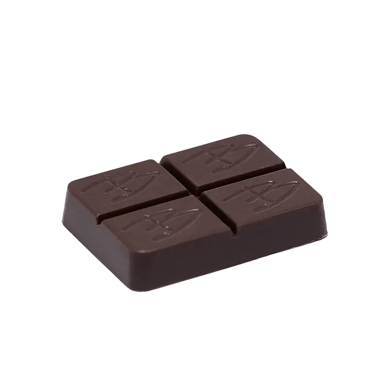 A close-up of the Caramel Chocolate THC:CBD square, displaying its dark, rich color and smooth texture.