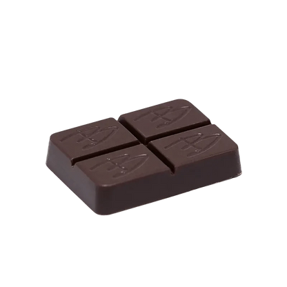 A close-up of the Caramel Chocolate THC:CBD square, displaying its dark, rich color and smooth texture.