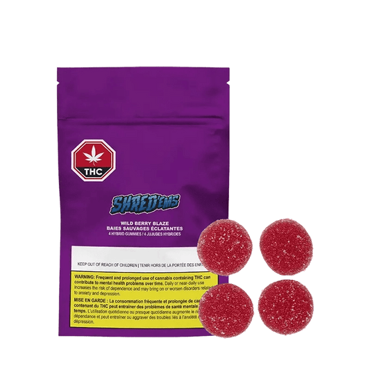 Front view of the Wild Berry Blaze Gummies packaging, displaying bold text on a purple and red background.