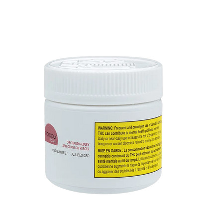 Close-up of Orchard Medley Gummies packaging with a warning message in French against frequent use.