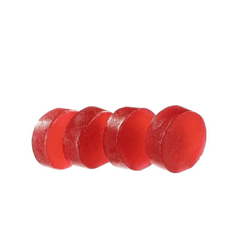 A close-up of the red Sugar Free Raspberry Acai 1:1 Gummies, arranged in a neat, linear formation against a white background.