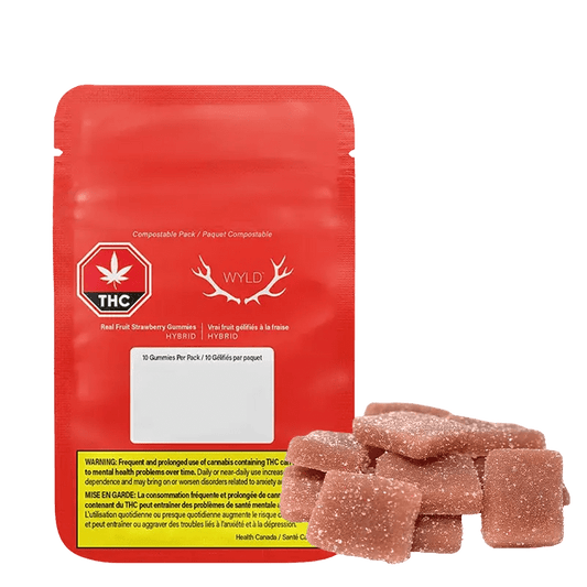 Real Fruit Strawberry CBD Gummies are shown in a close-up shot of a clear compostable package with a green cannabis leaf symbol.