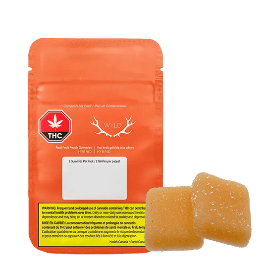 Close-up of Real Fruit Peach 5:1 Gummies packaging, displaying a vibrant design with THC and hybrid indicators.