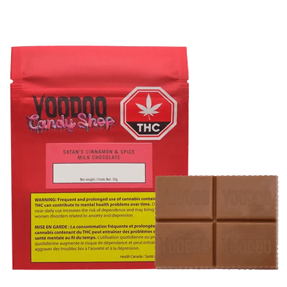 Front view of the Vomno Cinnamon & Spice chocolate bar packaging, displaying a warning label with a dark background.