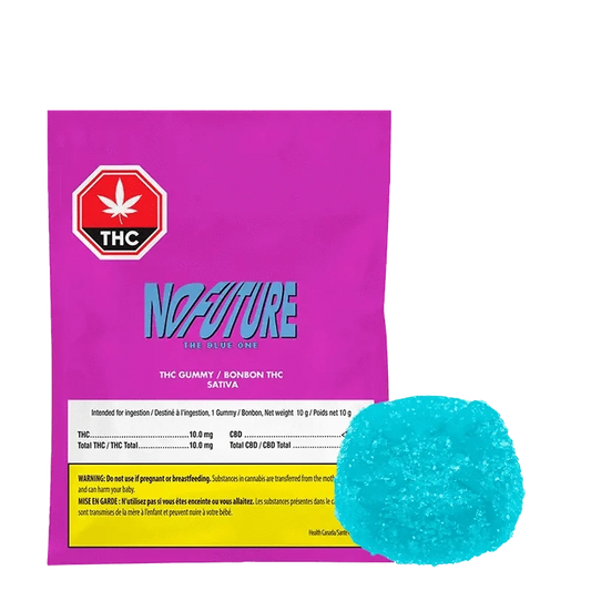 Front view of “The Blue One” gummy, showing bold text on a vibrant blue background with a white leaf symbol.