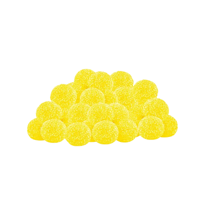 A close-up, top-down view of Lemon Dream CBN Gummies, displaying a pile of golden-yellow, round candies.