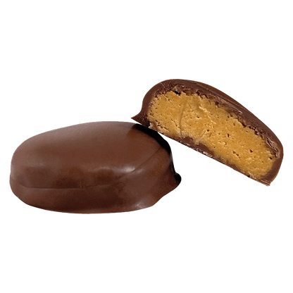 Close-up view of the Peanut Butter Bite with a broken piece revealing its creamy filling.