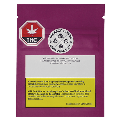 Close-up of the Wild Raspberry Thc Organic Dark Chocolate bar packaging with a red and white label, angled slightly to the right.