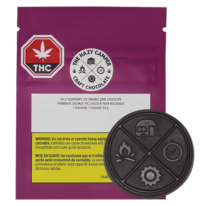 Close-up of Wild Raspberry Thc Organic Dark Chocolate packaging with a dark background and a prominent cannabis leaf logo.