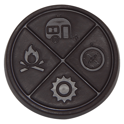 Overhead view of the Wild Raspberry Thc Organic Dark Chocolate, showing a circular dark-colored object with subtle textures.