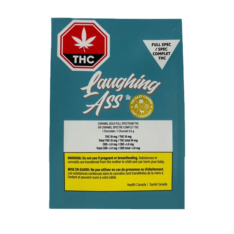 Close-up of Caramel Gold Full Spectrum THC Chocolate packaging featuring bold text and a cannabis leaf against a dark background.