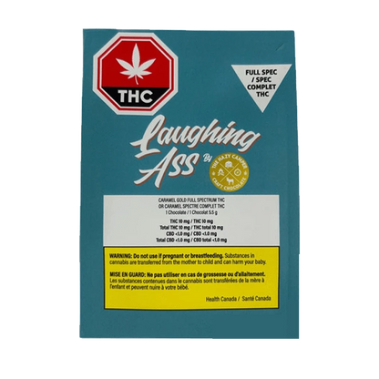 Close-up of Caramel Gold Full Spectrum THC Chocolate packaging featuring bold text and a cannabis leaf against a dark background.