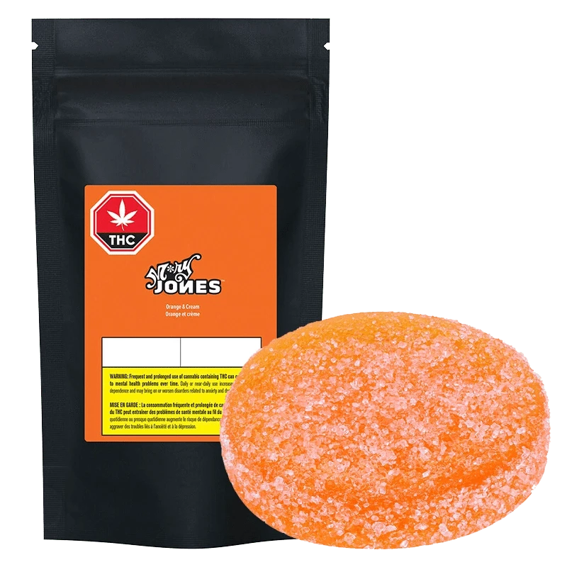 Close-up of the packaged Orange & Cream Gummies by STØNER, showing the branded design with a THC warning label.