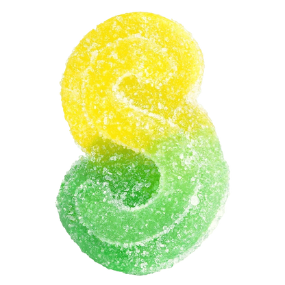 A close-up overhead view of Fully Blasted Mango Lime 1:1 CBC:THC Gummies, showing vibrant yellow and green hues.