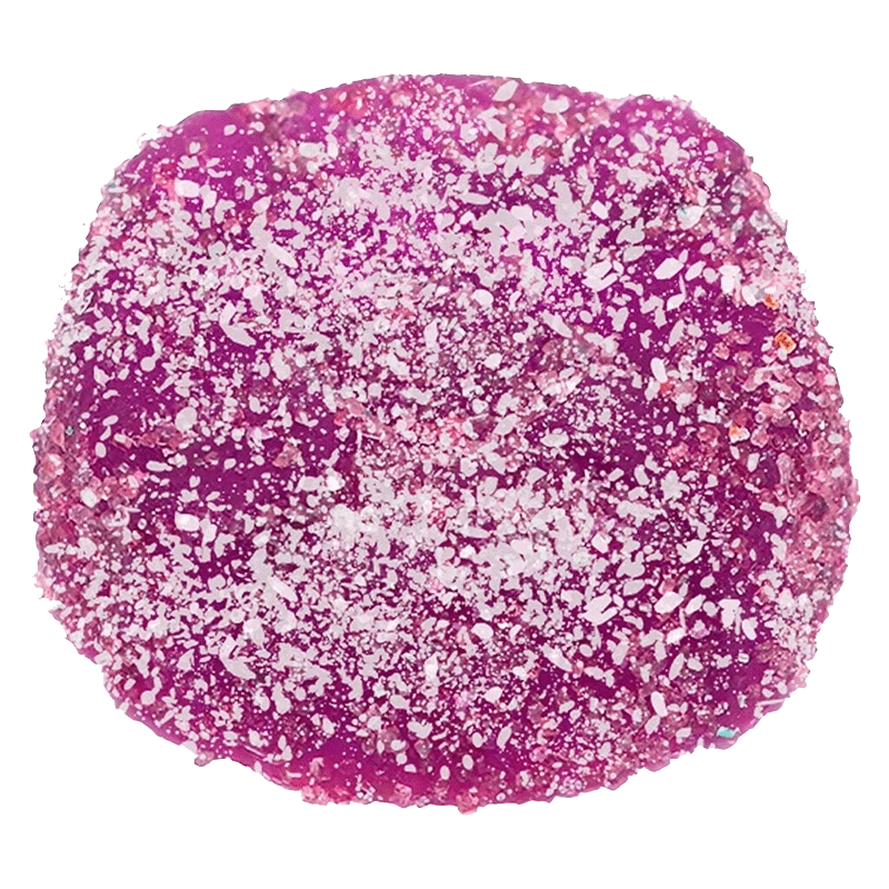 A close-up of the purple CBD Bomb - The CBD Pectin Purple One Gummy, showcasing its smooth, rounded texture.