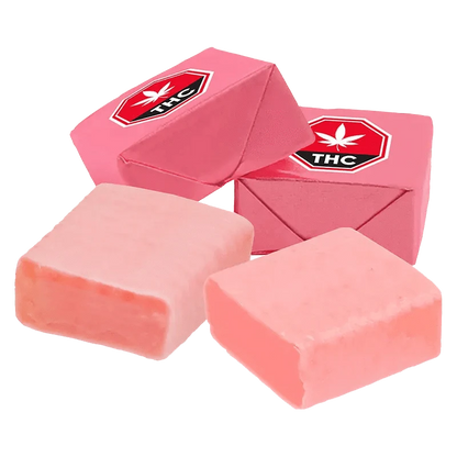 A close-up overhead view of the 3:1 Original Strawberry Taffy CBG/THC Gummies, showing a stack of colorful, square candies.
