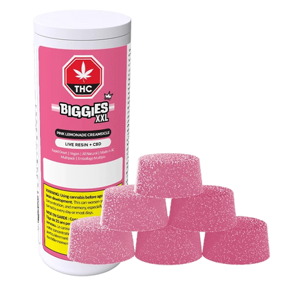 Front view of a pink-labeled Biggies XXL Pink Lemonade Creamsicle Live Resin THC:CBD Gummies 6 Pack container with six sugar-coated pink gummies stacked in front.