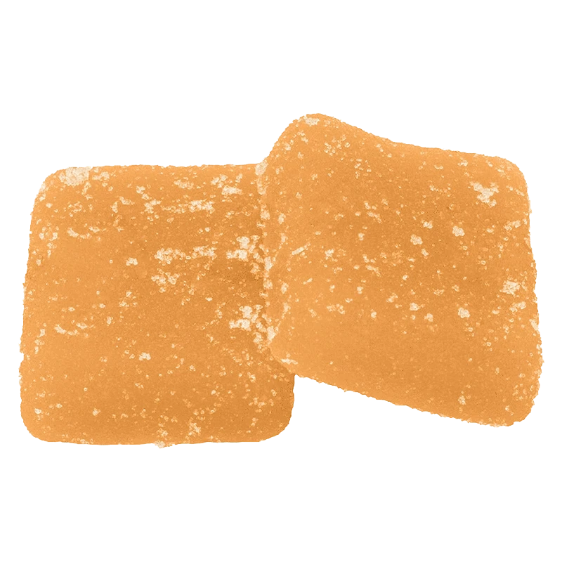 Top-down close-up of two sugar-coated orange squares of Sour Peach Mango 3:1 CBG:THC Gummies.