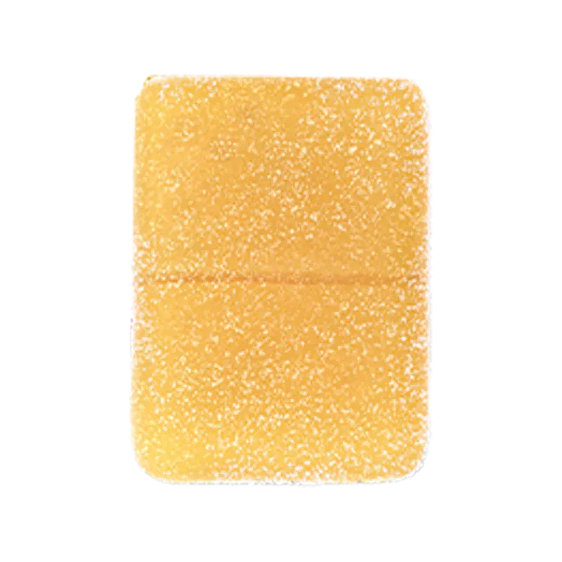 Close-up front view of a rectangular sugar-coated gummy in golden grapefruit color from Real Fruit Grapefruit 1:1:1 THC:CBG:CBC Gummies.