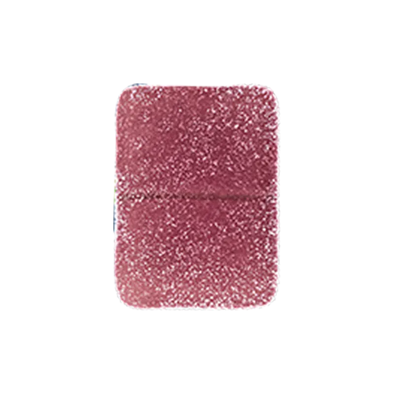 Top-down close-up of a single sugar-coated Pomegranate 1:1 THC:CBD Gummies square candy showing its textured pink-red surface.