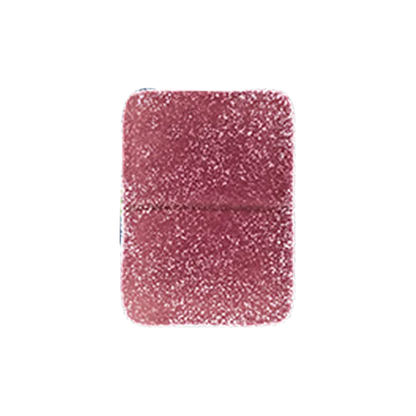 Top-down close-up of a single sugar-coated Pomegranate 1:1 THC:CBD Gummies square candy showing its textured pink-red surface.