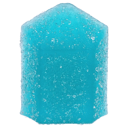 Close-up of a sugar-coated, bright blue gummy in a pentagon shape from THC+CBN Blue Topaz Crystal Blue Raspberry Gummies.