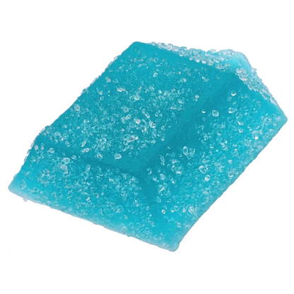 Close-up angled view of a sugar-coated blue gummy from THC+CBN Blue Topaz Crystal Blue Raspberry Gummies, showing crystalline sugar granules on a bright turquoise surface