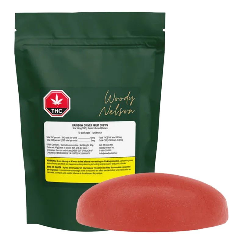Front view of a green pouch and a single red gummy, showing the Rainbow Driver Cured Resin Fruit Gummies pouch standing upright with its label and a rounded red chew in front.