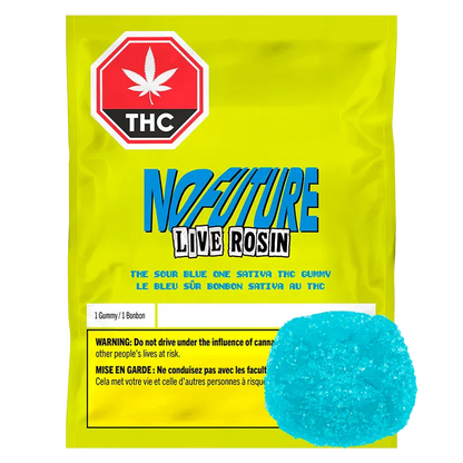 Yellow packet photographed front-on with a blue sugar-coated gummy in the lower right, labeled The Sour Blue One Live Rosin THC Gummy.