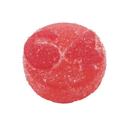 Top-down close-up of a sugar-coated red gummy, Strawberry Watermelon Live Rosin THC Gummies, showing textured surface and subtle circular indentations