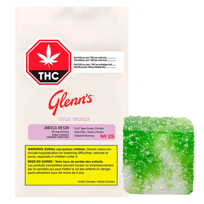 Front view of the Green Apple Carton True Indica Resin Gummies 10 Pack pouch with red THC symbol and a sugar-coated green gummy beside it.