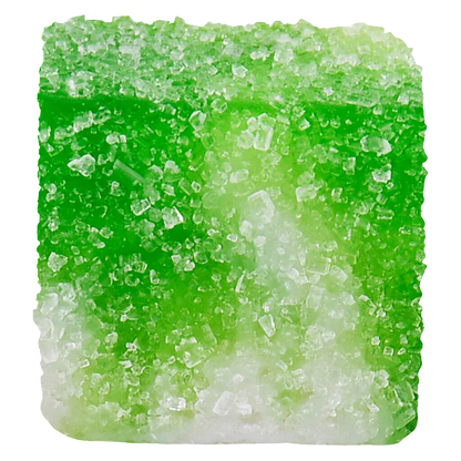 Close-up of a sugar-coated green gummy showing crystalline texture and square shape, labeled Green Apple Carton True Indica Resin Gummies