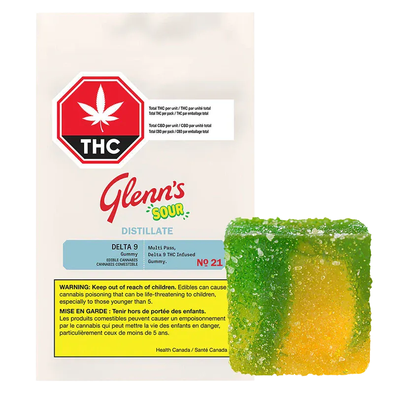 Packshot of the No.21 Distillate Delta 9 Sour Mango pouch with a green-and-yellow sugar-coated gummy placed to its lower right.