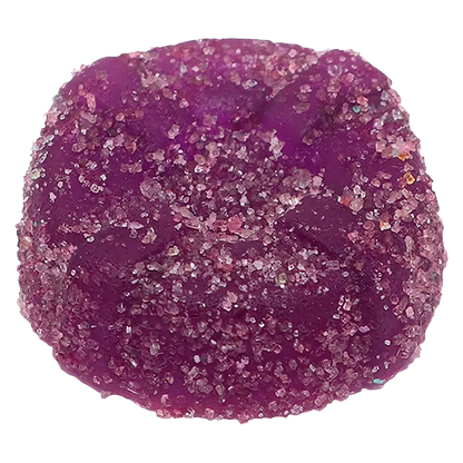 Close-up top view of a sugar-coated purple gummy, the Sour Purple One Live Rosin Indica Gummies shown against a white background.