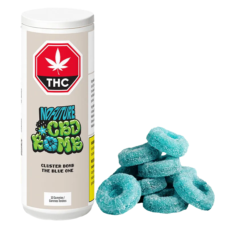 White cylindrical container labeled "CBD Cluster Bomb - The Blue One Gummies" stands to the left of a small pile of sugar-coated blue ring gummies.