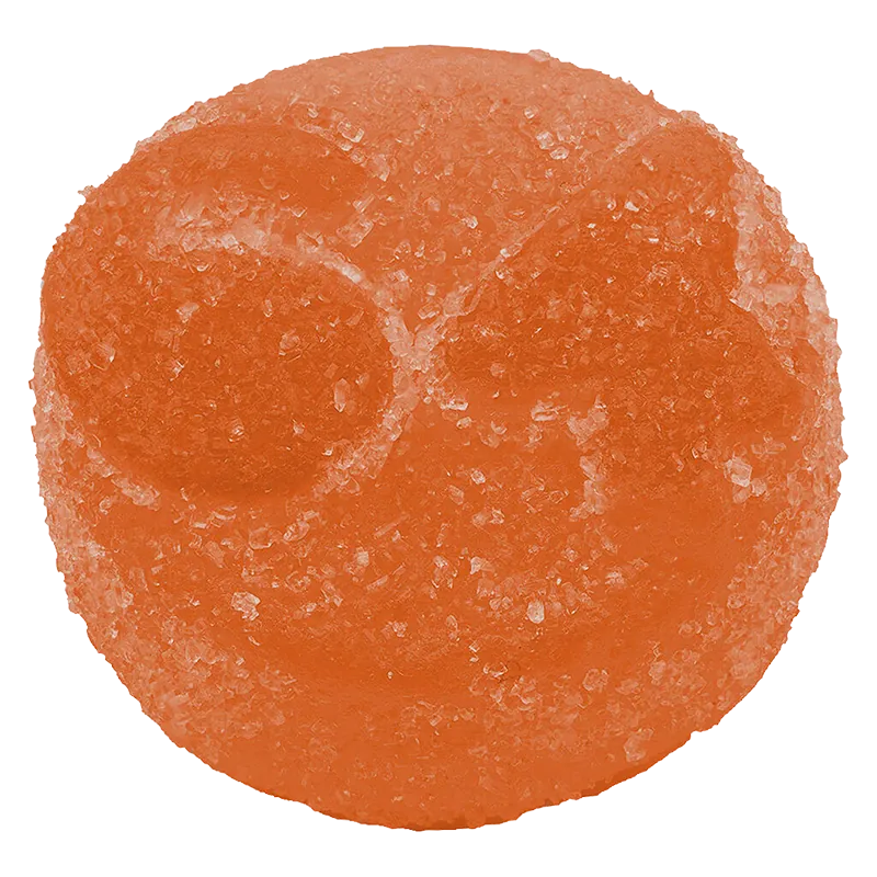 Close-up top view of an orange, sugar-coated gummy showcasing texture and two shallow circular indents, Fzy Peach THC:CBG Live Rosin Gummies