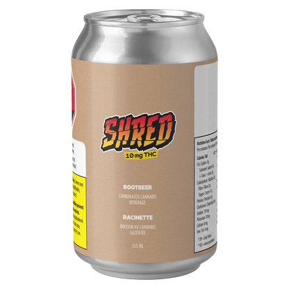 Angled front view of a Shred Rootbeer 6 Pack can with beige label, bold "SHRED" logo and nutrition panel visible on white background