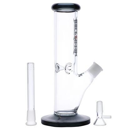 Straight-on studio shot of the Dopezilla Slimzilla Water Pipe - Transparent Black - 10in. showing the cylindrical clear body, black-rimmed mouthpiece and base, angled joint, and two separate glass accessories.