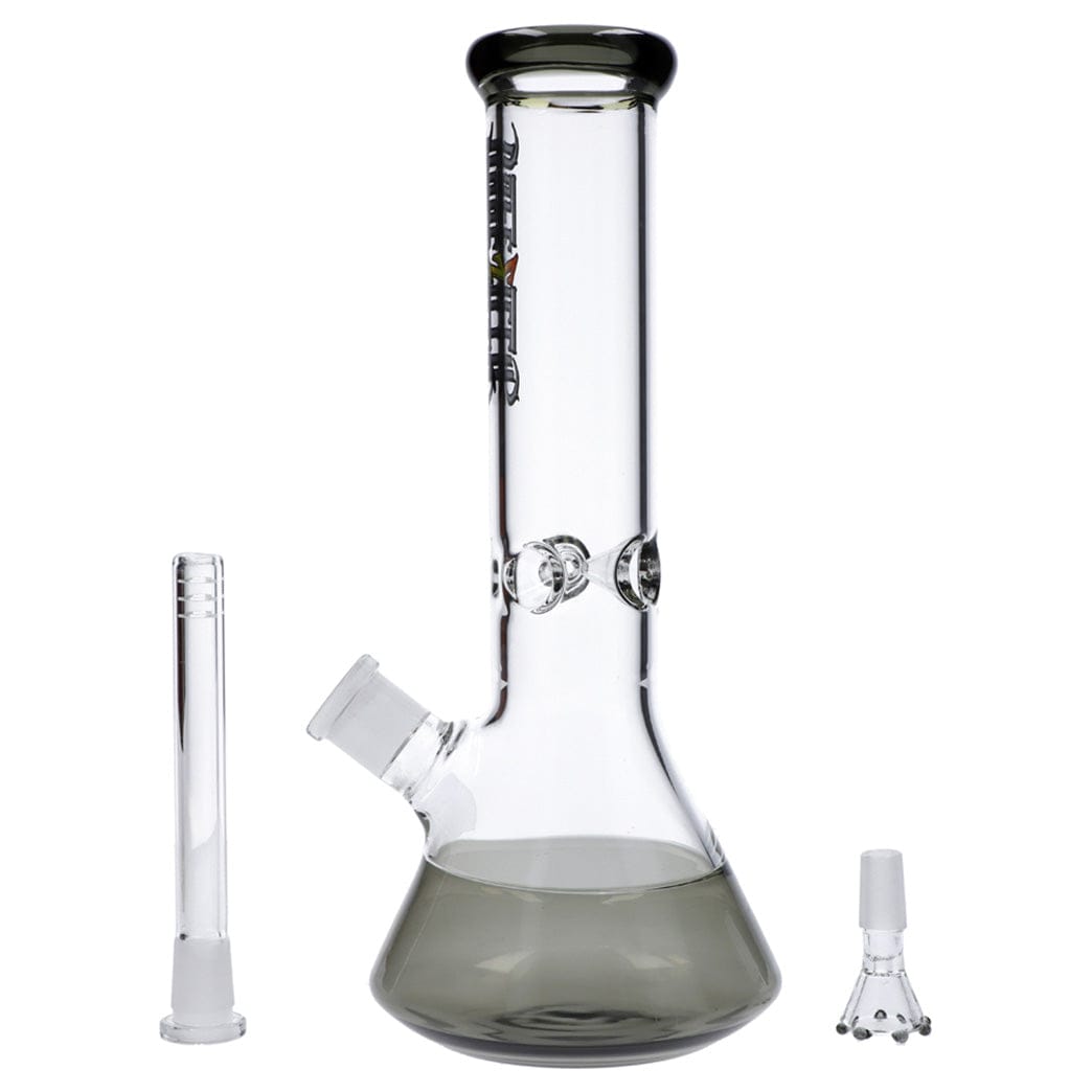 Front view of the Dopezilla New York Water Pipe - Transparent Black - 12in. showing a 12-inch beaker base with smoky black tint, two glass accessories beside it on a white background