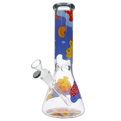 Angled view of the Famous Design Papaya Water Pipe - 12in. showing a clear beaker base and tall neck decorated with colorful abstract papaya-like shapes.